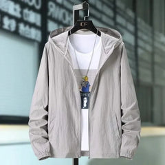 Light grey hooded summer jacket with zip front and elastic cuffs, worn over a tee