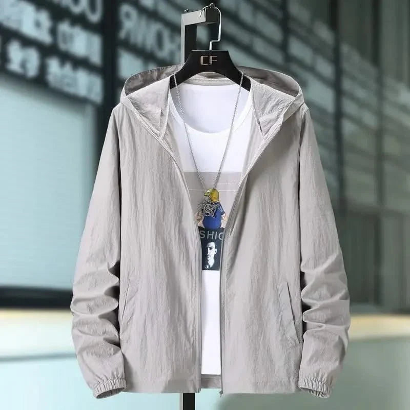 Light grey hooded summer jacket with zip front and elastic cuffs, worn over a tee