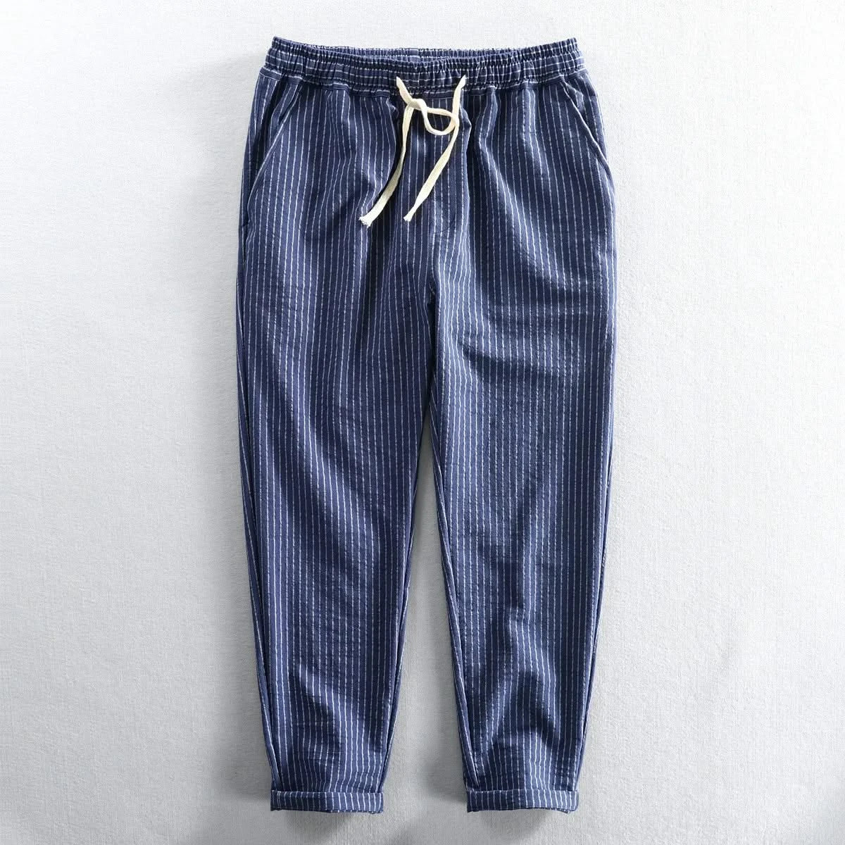 Blue striped linen pants with elastic waistband and drawstring tie, cuffed ankle length