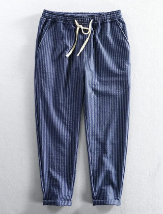 Navy blue striped linen pants with elastic waist and drawstring, relaxed ankle fit