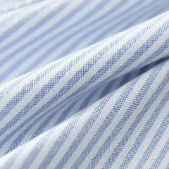 Blue and white striped linen fabric close-up with fine pinstripe texture