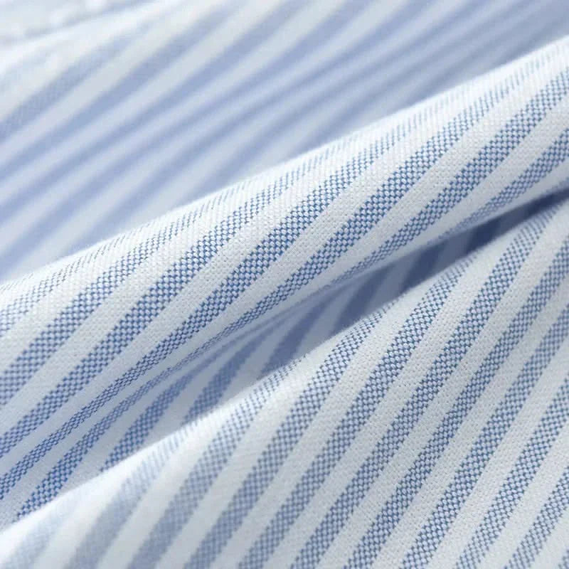 Blue and white striped linen fabric close-up with fine pinstripe texture
