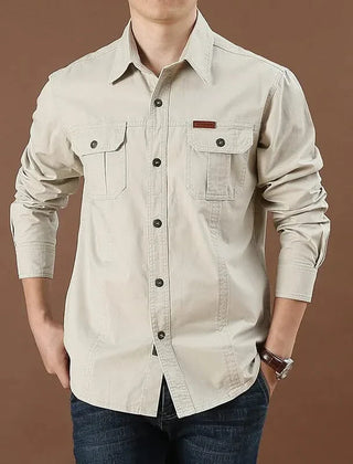 Beige button-up adventure shirt with dual chest pockets and button cuffs