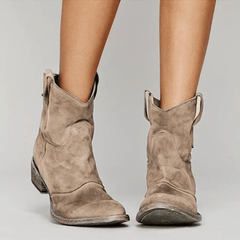 Light brown suede orthopedic ankle boots with block heel and pull-on loop detail
