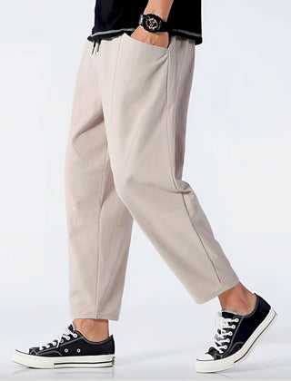 Khaki cropped cotton pants with drawstring waist and tapered straight legs
