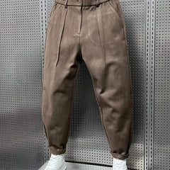 Men’s tan modern-fit trousers with pleated front, button waistband and cuffed hem
