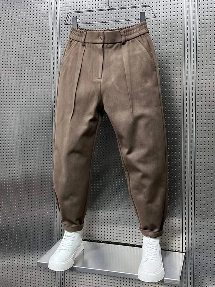 Men’s tan modern-fit trousers with pleated front, button waistband and cuffed hem