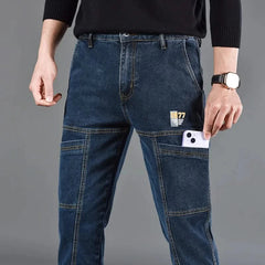Blue utility jeans with button waist, front cargo pockets, and stitched panels