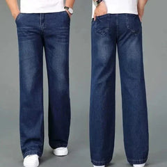 Dark blue flare boot cut jeans, front view with belt loops and denim whisker marks