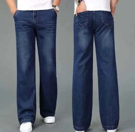 Dark blue flare boot cut jeans, front view with belt loops and denim whisker marks