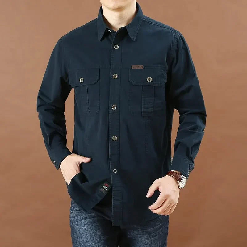 Navy button-up adventure shirt with two chest flap pockets and long sleeves