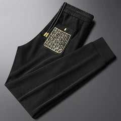 Black ribbed cotton pants, elastic waist with drawstring, front decorative pocket