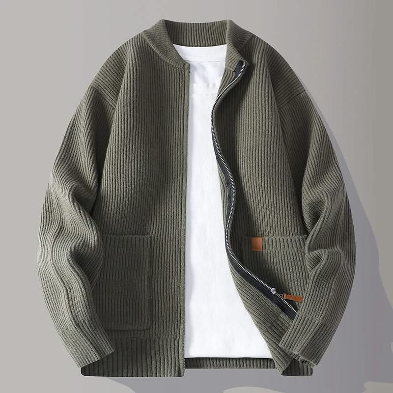 Green rib knit zip-up jacket with stand collar, front pockets, and tan logo patch