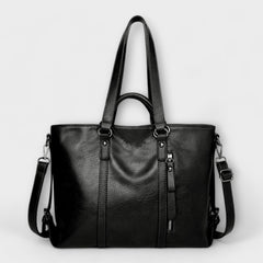 Black large leather handbag with top handles and side shoulder straps