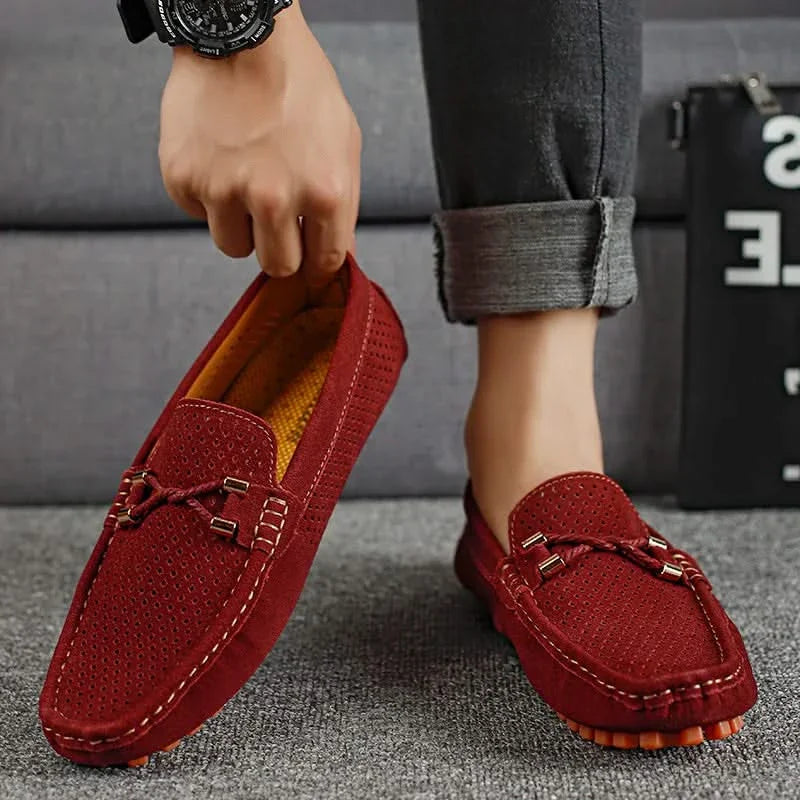 Red perforated leather loafer with metal bar detail and moccasin stitch trim