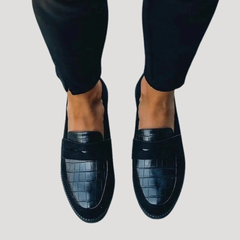 Dark blue croc-embossed leather loafers with wide strap across the top