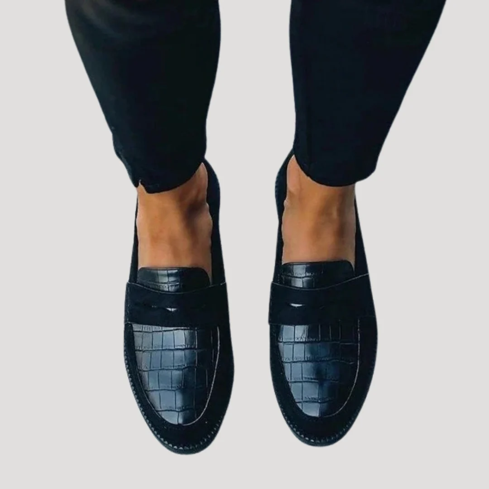 Dark blue croc-embossed leather loafers with wide strap across the top