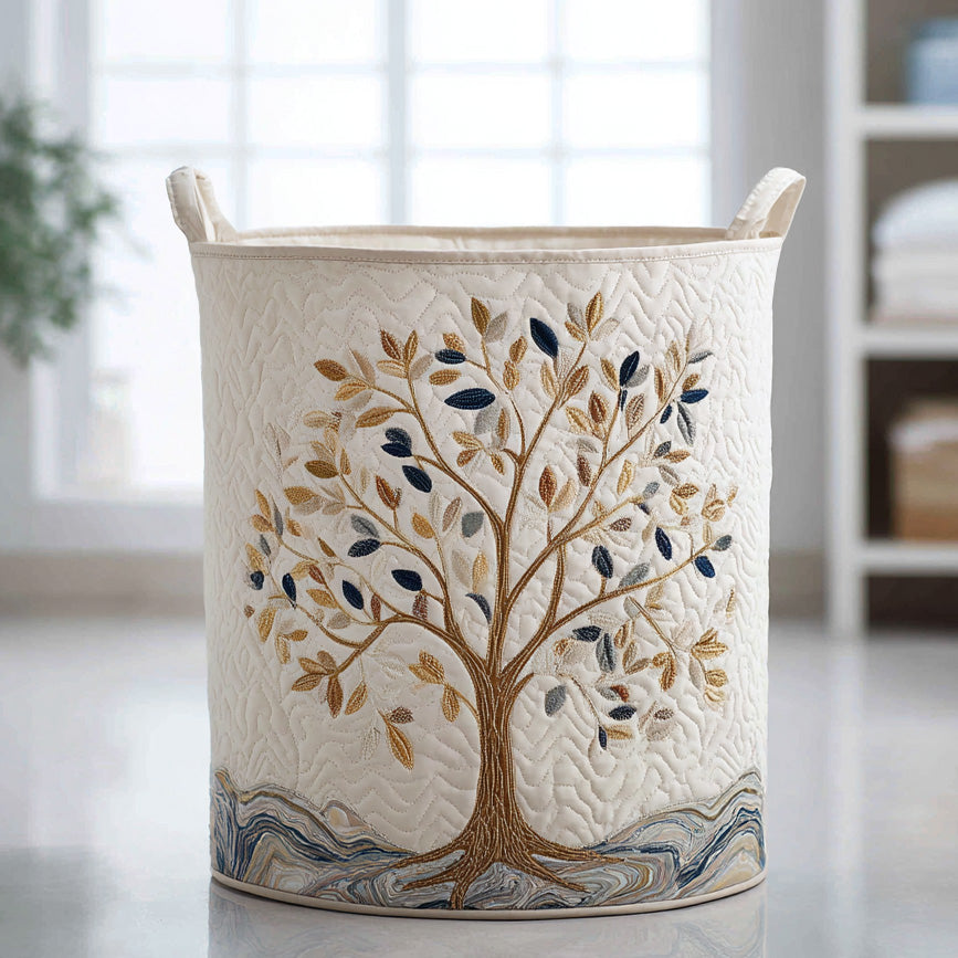 Fabric laundry basket in cream with tree embroidery and padded rim handles