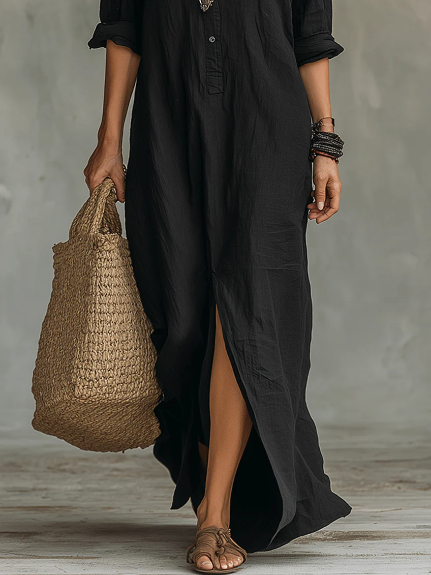 Black maxi dress with side slit and button front, three-quarter sleeves, relaxed fit