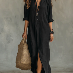 Black button-front maxi dress with V-neck, three-quarter sleeves, and side slit hem