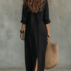 Black button-front maxi dress from back view, three-quarter sleeves, side slit