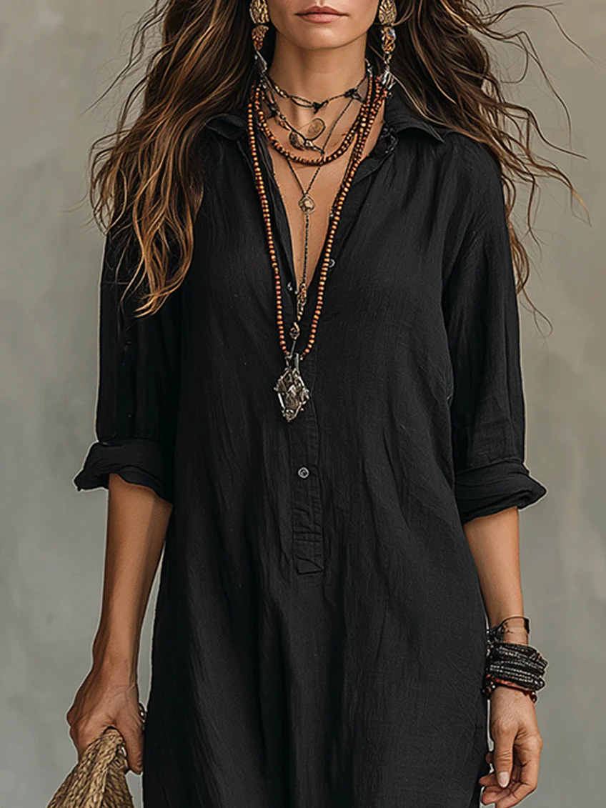 Black button-front maxi dress with V-neck and three-quarter sleeves, front button placket