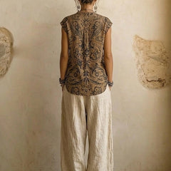 Layered three-piece set: back of patterned sleeveless tunic and linen drawstring pants
