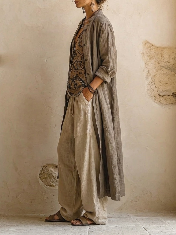 Layered three-piece set: patterned vest under olive long shirt, linen drawstring pants