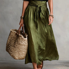 Two-piece set: black blouse and olive green midi skirt with bow tie waist