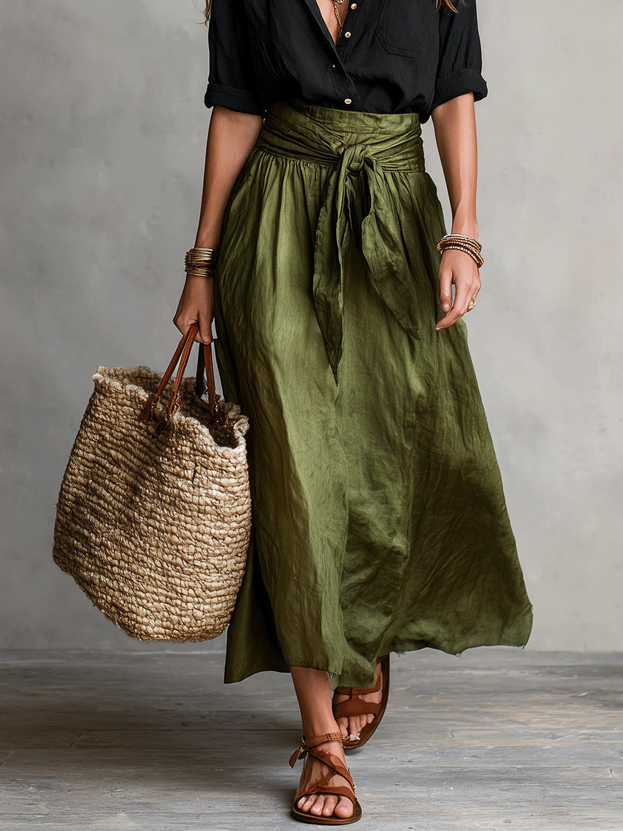 Two-piece set: black blouse and olive green midi skirt with bow tie waist