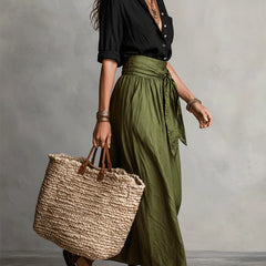Two-piece set: black blouse and olive green midi skirt with tie waist