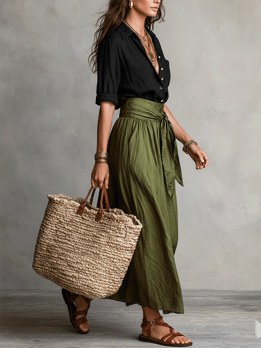 Two-piece set: black blouse and olive green midi skirt with tie waist