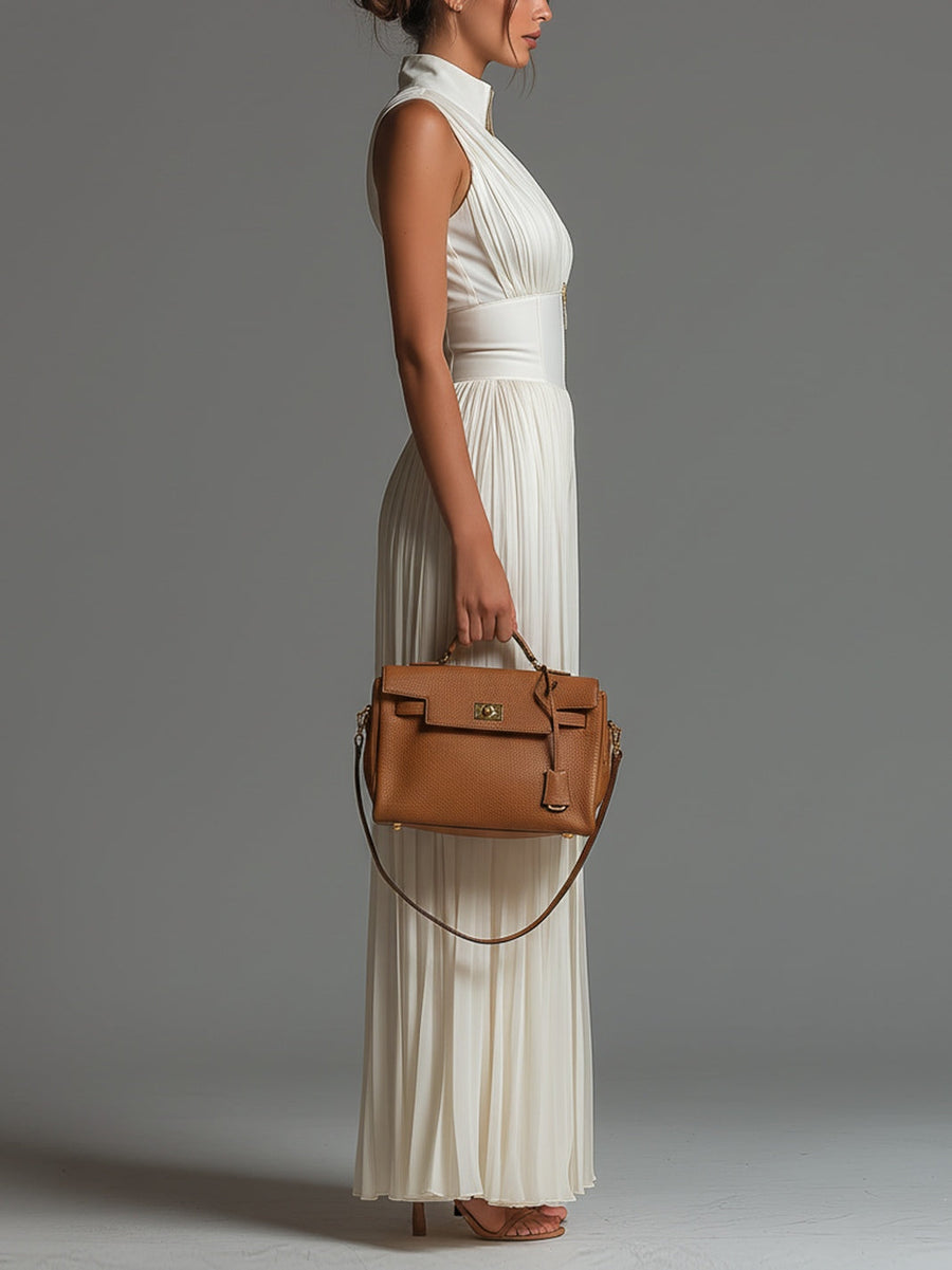 White pleated chiffon halter jumpsuit with fitted waist and wide-leg trousers, side view