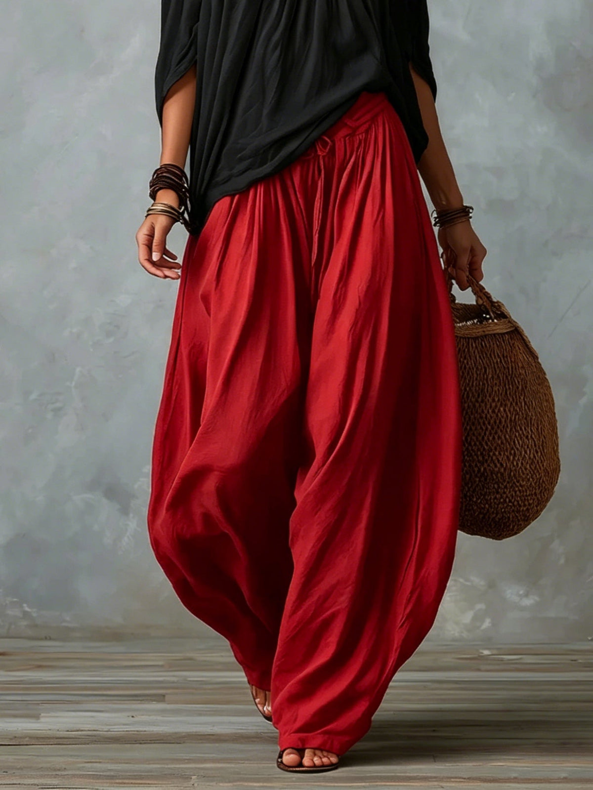 Black off-shoulder top and red lantern trousers set, side view