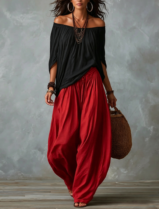 Black off-shoulder top and red lantern trousers set