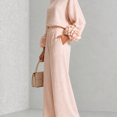 Blush two-piece set with long-sleeve blouse and wide-leg pants, floral cuff sleeves