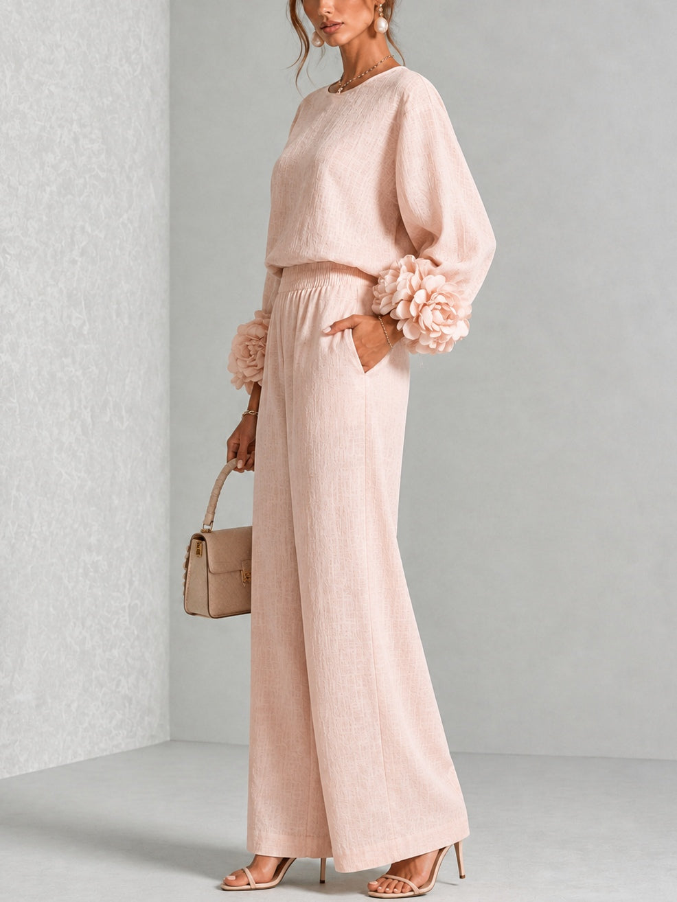 Blush two-piece set with long-sleeve blouse and wide-leg pants, floral cuff sleeves