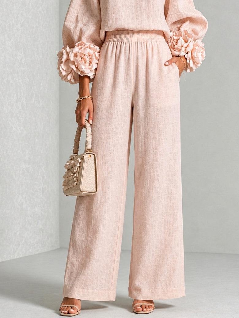 Blush wide-leg pants with matching blouse, elastic waist and floral cuff sleeves
