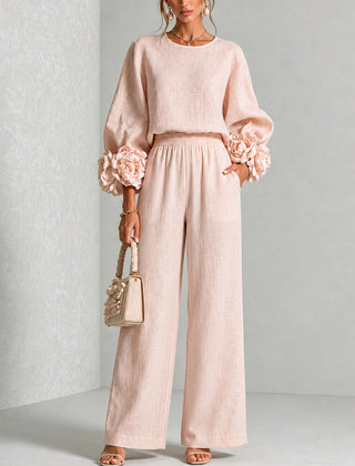 Blush two-piece set: long-sleeve blouse and wide-leg pants with floral cuff details