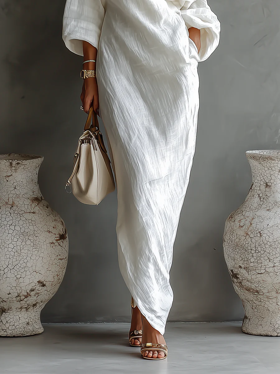 White one-shoulder maxi dress with wrap drape front and bracelet-length sleeves