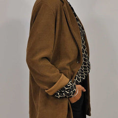 ELVIRA™ black geometric V-neck blouse, side view, long sleeves and button placket.
