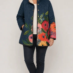 Amaya vintage floral quilted jacket on model, dark blue with multicolor flower panels