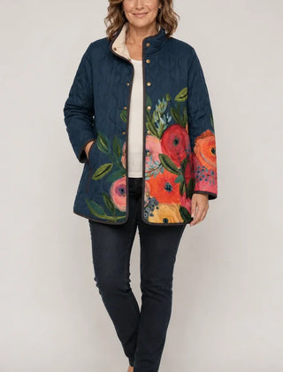 Amaya vintage floral quilted jacket on model, dark blue with multicolor flower panels
