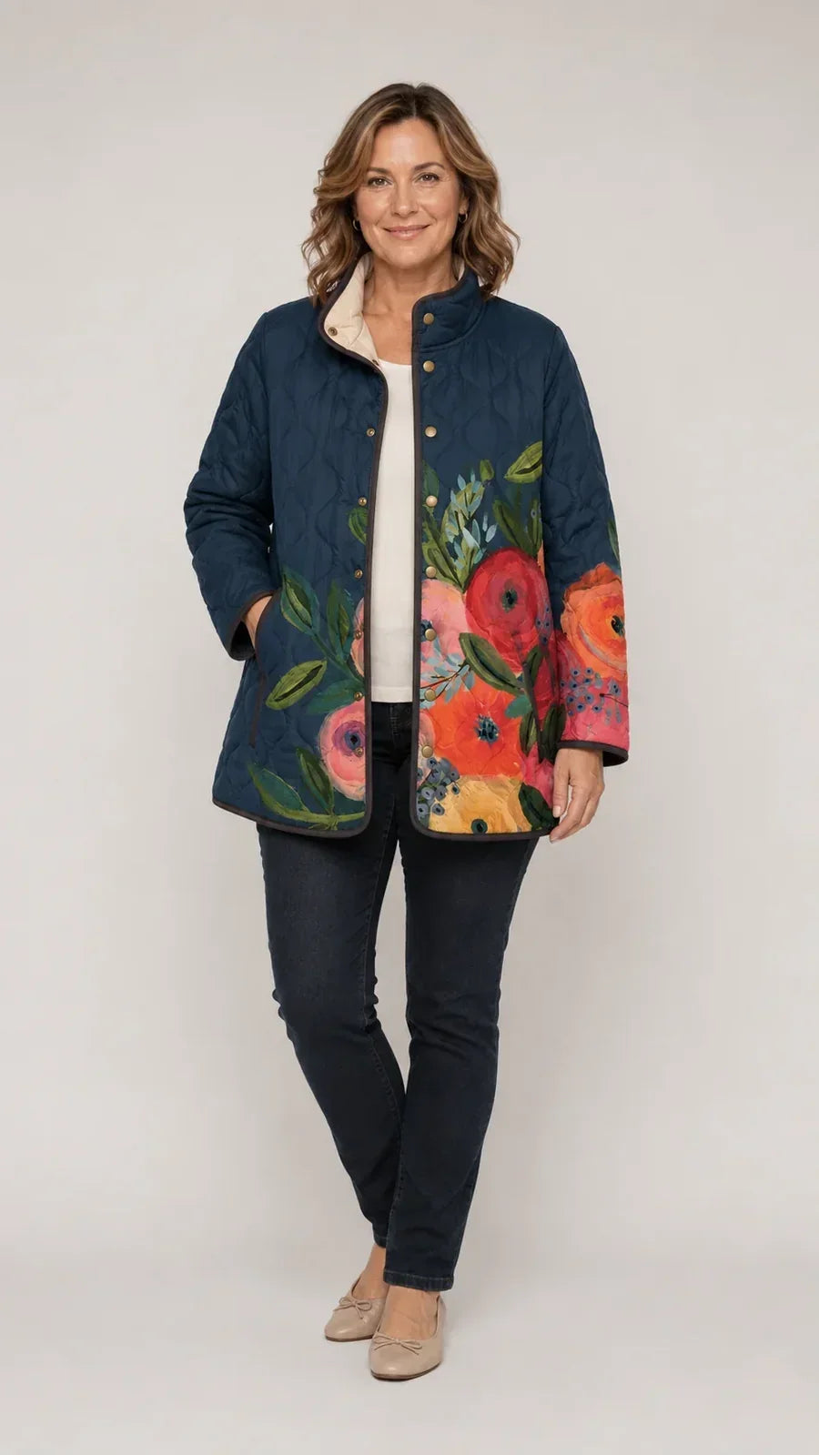 Amaya vintage floral quilted jacket on model, dark blue with multicolor flower panels