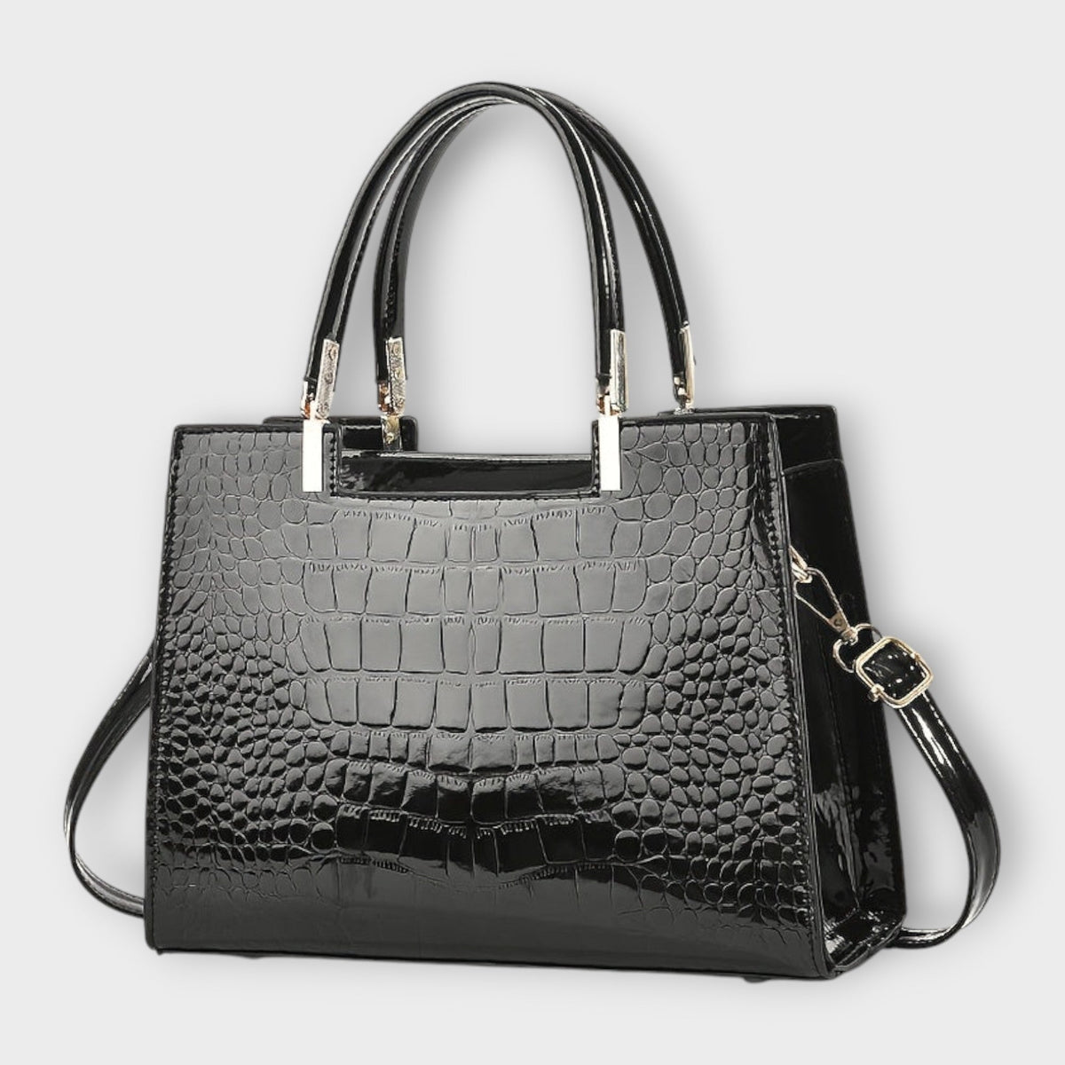 Shiny crocodile-pattern handbag in dark black with top handles and crossbody strap