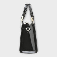Shiny crocodile-pattern handbag in black with top handles and side strap hardware