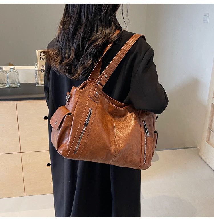 RAE Classic leather handbag in tan-brown leather with front zips and adjustable shoulder strap