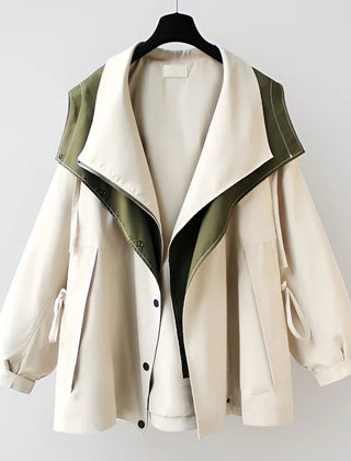 Beige windbreaker jacket with green-lined interior and snap-front, side pockets