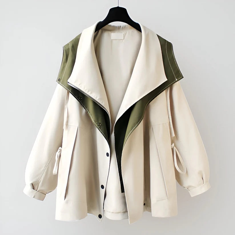 Beige windbreaker jacket with green-lined interior and snap-front, side pockets