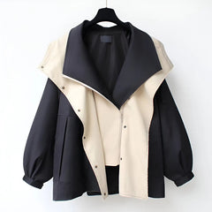 Black and beige windbreaker jacket with snap-front and contrast asym panels